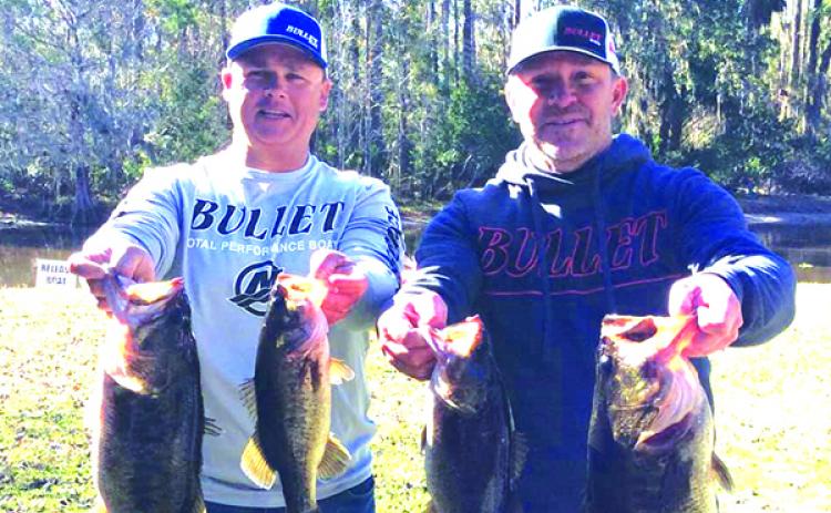 Lee Stalvey, left, and Jason Caldwell show off their winning catches during Saturday’s opening Xtreme Trails event. (Contributed)
