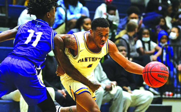 Palatka’s Jimmie Williams looks for a way to the basket against Gainesville P.K. Yonge in December. (GREG OYSTER / Special To The Daily News)