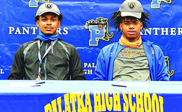 Palatka's O'Marrion Wilson (left) and Shemar Curry pose together after signing letters of intent with Warner University. (Submitted)