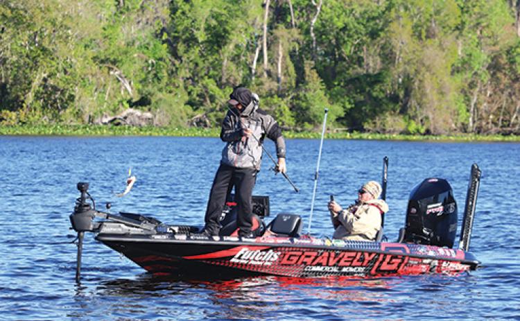 A marshal sits while recording an angler’s activities during a previous Bassmaster Elite Series event on the St. Johns River in Putnam County. 