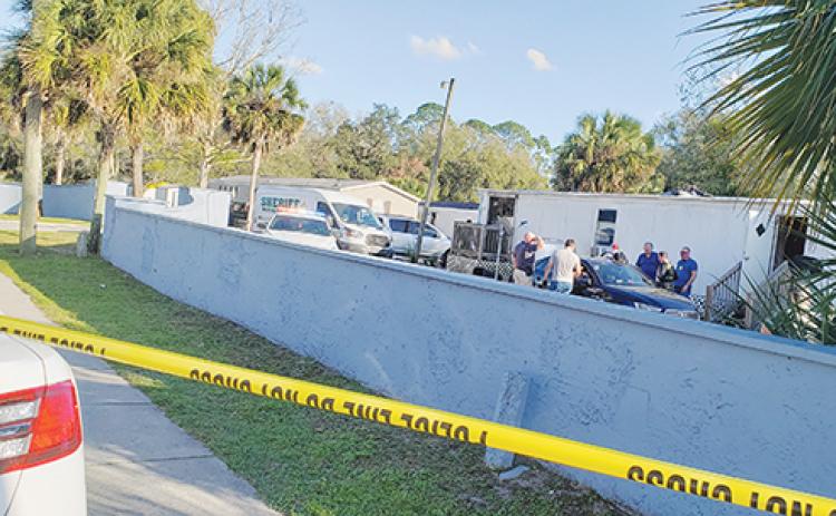 The Alhambra Mobile Home Community in Palatka was the scene of heavy law enforcement presence Thursday afternoon as a warrant was served and two people were placed in custody.