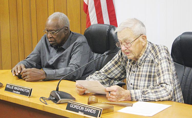 Mayor Gordon Sands, right, and Councilman Willie Washington discuss business during a Welaka Town Council meeting in 2019.