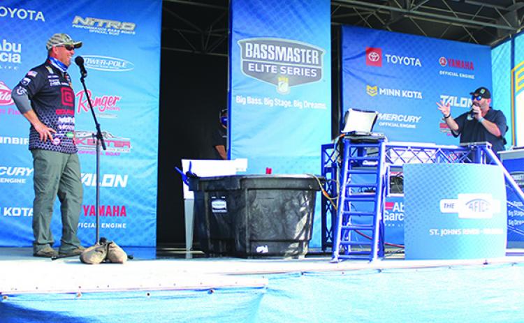 Cliff Prince, left, talks to AFTCO Bassmaster Elite At St. Johns River tournament host Dave Mercer during Friday’s second-day weigh-ins. (MARK BLUMENTHAL / Palatka Daily News)