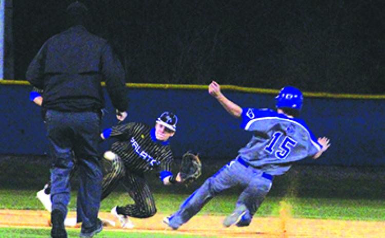  Interlachen’s Brock Foshee slides safely into second base as Palatka’s Seth Waltimyer takes the throw during Friday night’s championship game. (ANTHONY RICHARDS / Palatka Daily News)