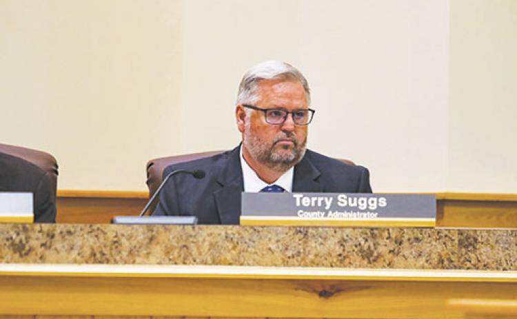Putnam County Administrator Terry Suggs listens Tuesday as the Board of County Commissioners schedule a meeting to discuss how to keep him from potentially leaving to work in Daytona Beach.