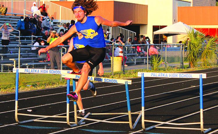 Palatka’s Seager Jordan stumbles over the final hurdle, but wins the 300-meter intermediate hurdles during his team’s meet with Interlachen on Tuesday. (MARK BLUMENTHAL / Palatka Daily News)
