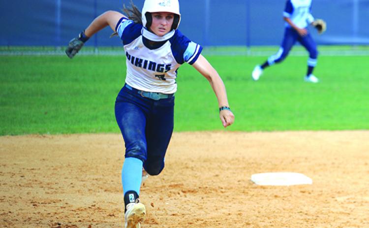 St. Johns River State College’s Ashley Kirkbride starts on her way to third base, but eventually goes back to second during the fifth inning of Thursday’s first game against Santa Fe. (ANTHONY RICHARDS / Palatka Daily News)