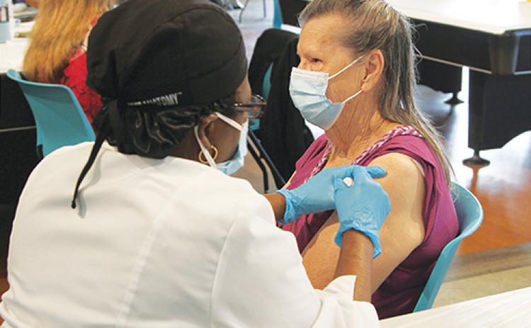 Palatka resident Thelma Donaldson, 79, receives the COVID-19 vaccination at SJR State.