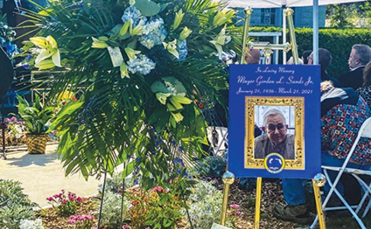A memorial stands at Welaka Town Hall on Saturday in memory of former Mayor Gordon Sands as family and friends gather to celebrate his life.