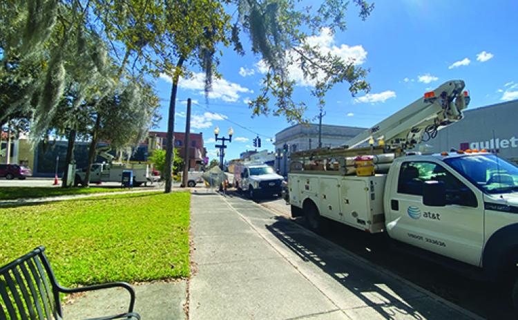 AT&T trucks are parked outside the Putnam County Courthouse on Thursday afternoon as crews continue working in downtown Palatka.