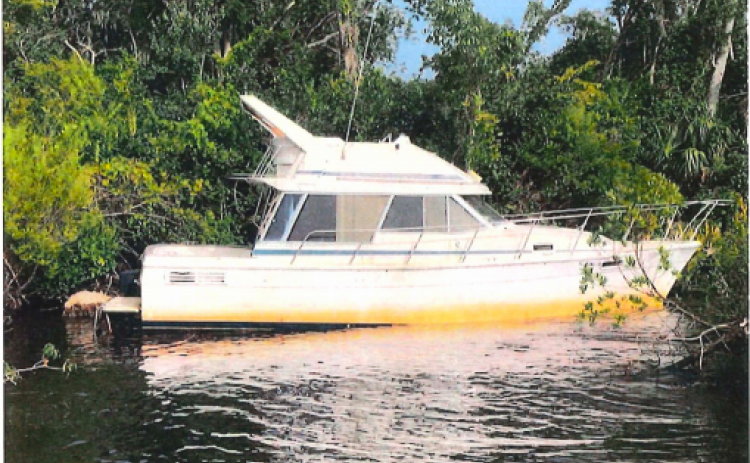 A derelict vessel sits on the St. Johns River in Putnam County. 
