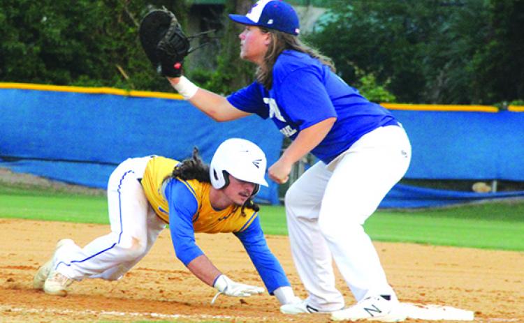 Palatka’s Layton DeLoach dives back into first base during Monday night’s loss at home against Keystone Heights. The Panthers travel to Port Orange Atlantic for a District 4-4A semifinal matchup with the Sharks on Wednesday. (ANTHONY RICHARDS / Palatka Daily News)