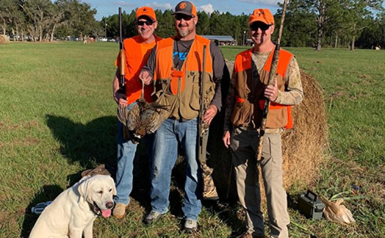 Hunters show off their haul from a pheasant hunt at Roberts Ranch in Palatka.