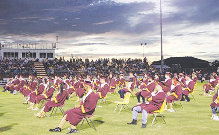 The Crescent City High School graduating class of 2020 sits through their commencement ceremony, which was postponed from June to August.