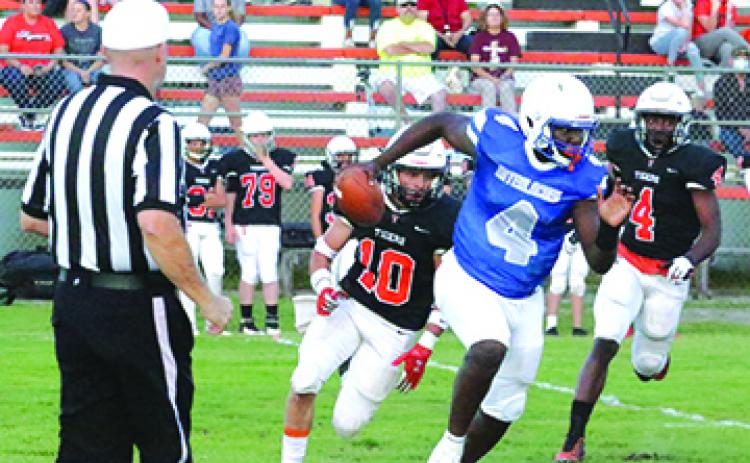 Interlachen High School quarterback Reggie Allen Jr. runs away from trouble in Friday night's loss to Trenton High, 38-18. (ANTHONY RICHARDS / Palatka Daily News)