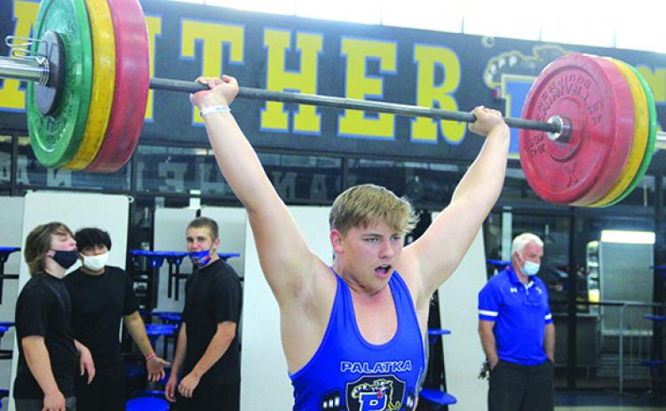 Palatka’s Jack Tilton delivers a successful clean and jerk lift at the Putnam County boys weightlifting championship on March 10 at Palatka High School. (ANTHONY RICHARDS / Palatka Daily News)