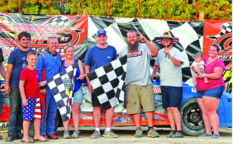 Jason Garver, fourth from left, celebrates with family and friends after winning the Street Stocks division on Sunday at The Church In The Dirt event at The Clip at Putnam Raceway. (Photo courtesy of The Clip at Putnam Raceway)