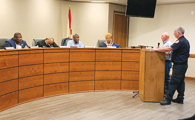 Palatka Fire Department Capt. Chad Branford and Chief Chris Taylor address city commissioners about employee pay during a meeting Thursday night.