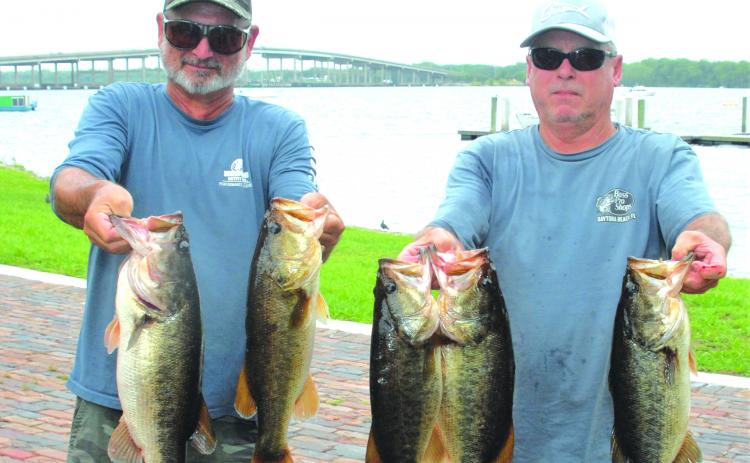 Billy Nearing, left, and Alan Hopper hold up their winning fish. (GREG WALKER / Daily News correspondent)