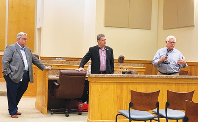 From left, Putnam County Administrator Terry Suggs, county Project Manager Sam Sullivan and TranSystems Vice President of Ports and Maritime Rick Ferrin listen to feedback from local business stakeholders at a meeting Thursday morning.