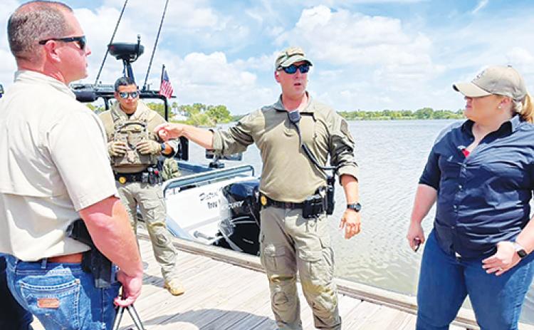 U.S. Rep. Kat Cammack, R-Fla., and Putnam County Sheriff Gator DeLoach talk to Texas Department of Public Safety Highway Patrol Division officers Thursday while learning about the border crisis along the Rio Grande River.