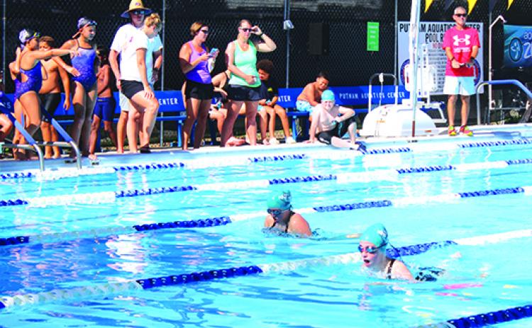 Hannah Antonio, right, outraces Georgia Stallings to win the 11-12-year-old girls 50-yard breaststroke during Saturday’s swim meet at the Putnam Aquatic Center. (MARK BLUMENTHAL / Palatka Daily News)