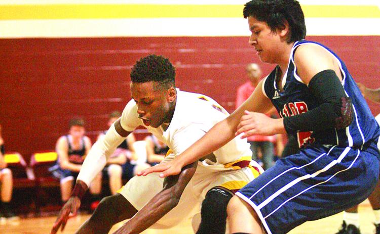 Crescent City High School’s Kenton Bibbs, left, moved from Palatka High before the 2013-14 season to help the Raiders reach the Region 4-1A final and earn Daily News Boys Basketball Player of the Year honors that winter. (Daily News file photo)