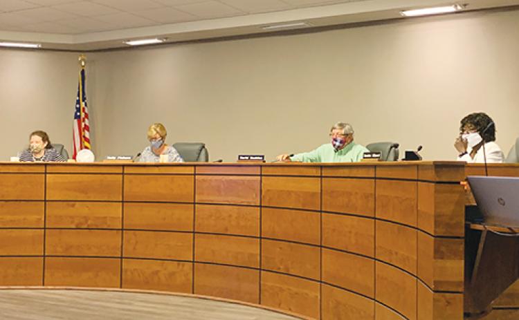 Putnam County School District board members discuss the first day of school during their meeting Tuesday.
