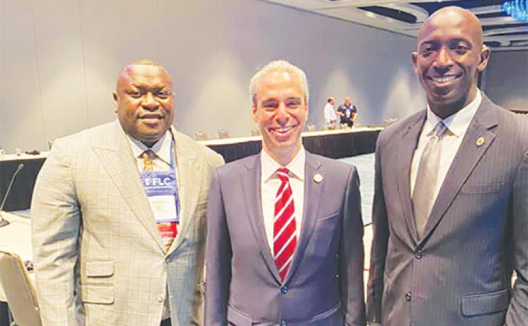 From left, Palatka Mayor Terrill Hill, Boca Raton Mayor Scott Singer and Miramar Mayor Wayne Messam gather at a Florida League of Mayors meeting.