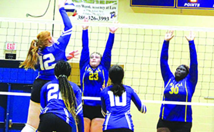 Interlachen’s Payton Alexander (12) delivers a kill in the fifth set against Palatka on Saturday as Palatka’s Riley Kenyon (23) and Torryence Poole (30) try to defend. (MARK BLUMENTHAL / Palatka Daily News)