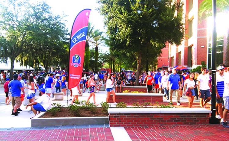 Fans file into Ben Hill Griffin Stadium before Saturday night’s kickoff between Florida and FAU. (MARK BLUMENTHAL / Palatka Daily News)