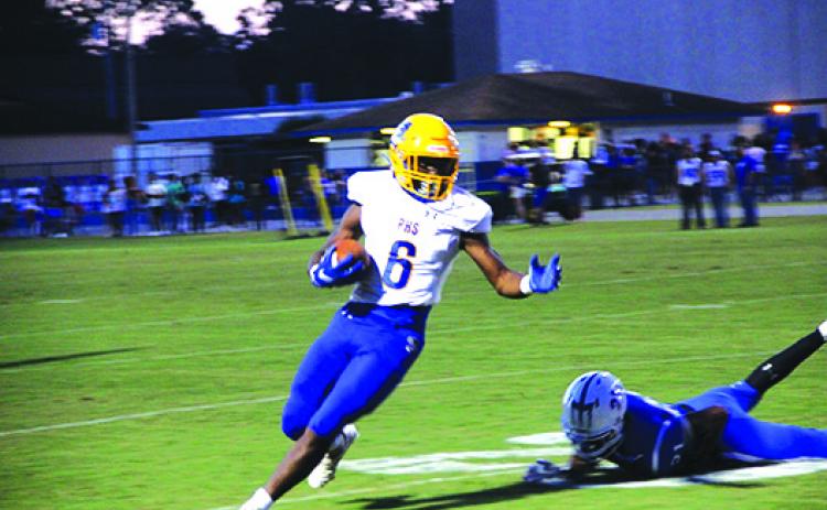 Palatka’s Leetrez Smith makes a Clay defender miss as he turns the corner to get some yards during Friday night’s game. (COREY DAVIS / Palatka Daily News)