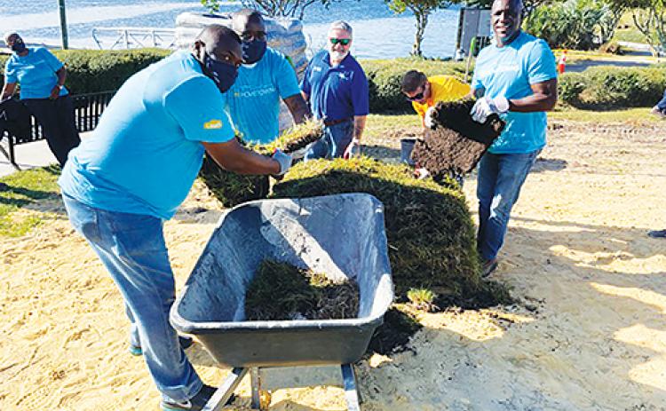 From left, Mayor Terrill Hill, Commissioner Justin Campbell, City Manager Don Holmes, General Services Director Jonathan Griffith and Commissioner Rufus Borom were among volunteers pouring sweat equity into the riverfront amphitheater project Tuesday morning.