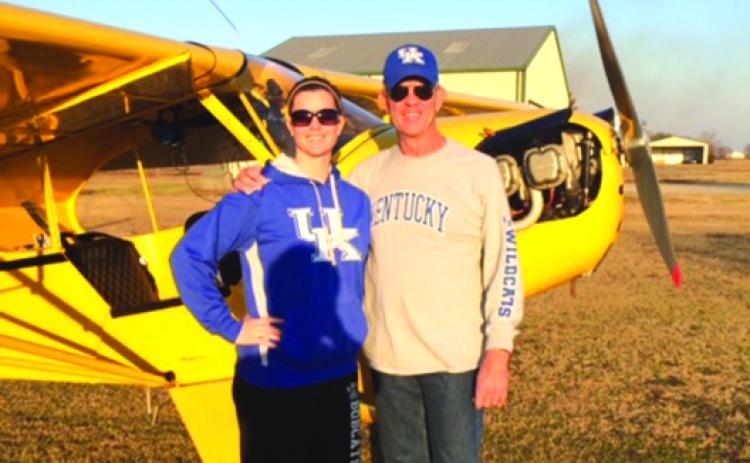 Former Palatka High School assistant football coach Bob Jones poses with his daughter Emily in front of his 1949 Piper J-3 Cub. (Submitted / BOB JONES)