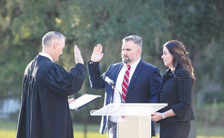 County Court Judge Joe Boatwright, left, administers an oath of office to Judge Kenneth J. Janesk on Friday during Janesk’s investiture ceremony at the World Golf Hall of Fame in St. Augustine.