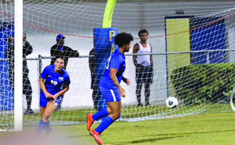 Palatka’s Lanie Hutchinson (18) is all smiles after teammate Jaylah Douglas scores the tying goal with five minutes left in Wednesday night’s match against Daytona Beach Mainland. (MARK BLUMENTHAL / Palatka Daily News)
