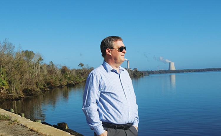 Sam Sullivan, Putnam County’s grants, projects and legislative affairs coordinator, overlooks the St. Johns River at the Palatka Barge Port on Thursday. 