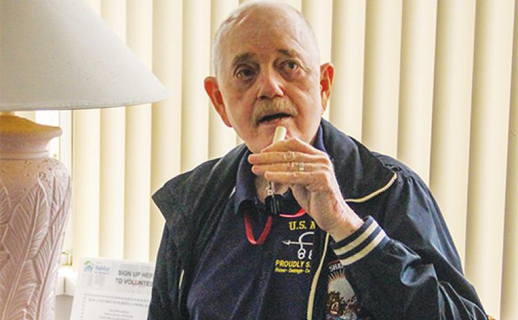 Satsuma resident and Vietnam War veteran Spencer Wainright III demonstrates his Stop One Suicide whistle Monday at the Putnam Habitat for Humanity office.