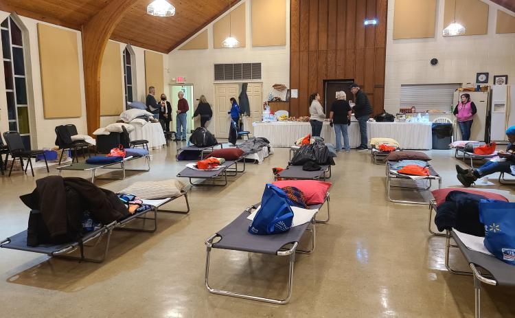 Cots are set up inside Westminster Hall at First Presbyterian Church.