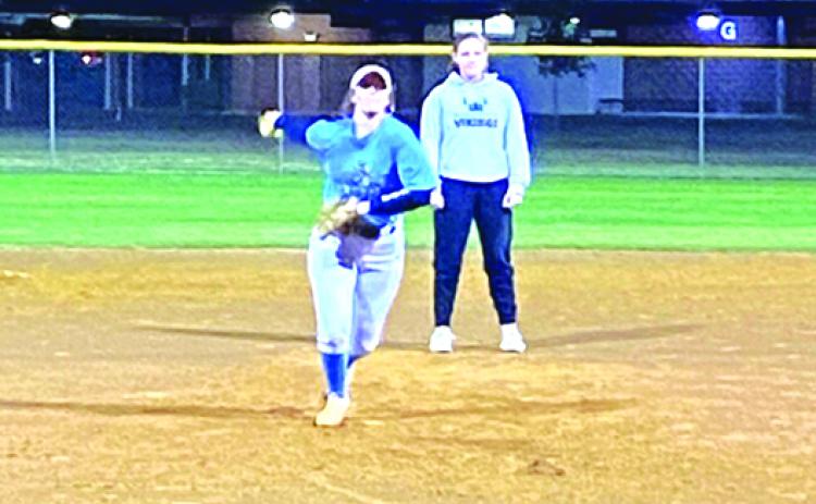 Lexi Phillips throws a pitch during a St. Johns River State College softball intra-squad game, while infielder Katie Thomas watches behind her. (COREY DAVIS / Palatka Daily News)