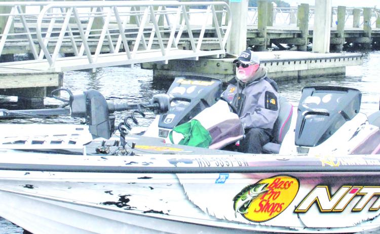 Rick Clunn, as recent a winner of the Bassmasters Elite at St. Johns River in 2019, sits in his boat along the Palatka dock Monday. (GREG WALKER / Daily News correspondent)