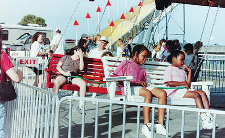 Children enjoy the rides during the 1999 Florida Azalea Festival in Palatka.