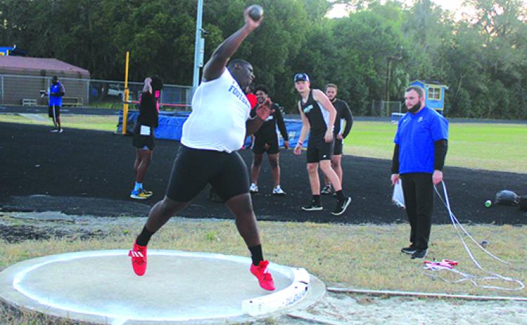  Palatka’s Daunte Wilkinson unleashes a shot put attempt during Tuesday’s tri meet at home against Interlachen and Keyston Heights. Wilkinson won the event. (MARK BLUMENTHAL / Palatka Daily News)