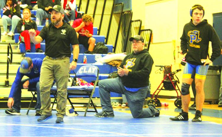 Palatka coach Josh White watched three of his wrestlers move on to the second day of the Region 1-1A tournament on Friday. (MARK BLUMENTHAL / Palatka Daily News)
