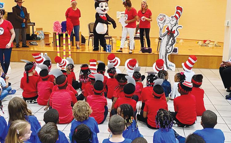 Children enjoy a reading of The Cat in the Hat at Ravine Gardens State Park in Palatka as part of the Early Learning Coalition’s Early Literacy Outreach Program.