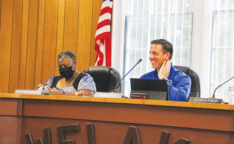 Welaka Town Councilwoman Kathy Washington and Mayor Jamie Watts listen to officials and residents talk about a proposed noise ordinance during a meeting in August..