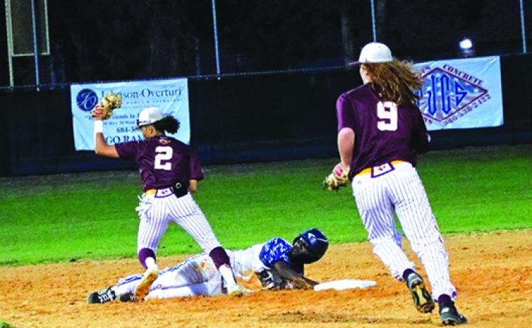 Crescent City’s Terrell Johnson finishes a pickoff of Interlachen’s Reggie Allen Jr. during the second inning of Friday night’s game. Behind the play is Crescent City’s Helmut Waters. (RITA FULLERTON / Special to the Daily News)