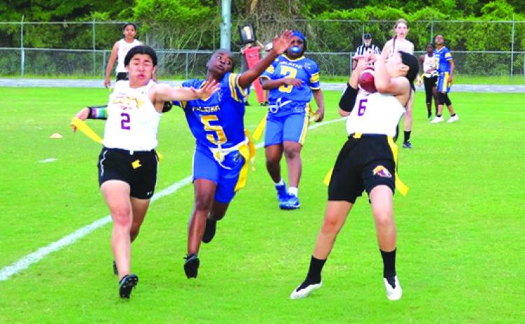 rescent City’s Alyssa Horsombath (6) hauls in an extra-point pass as Palatka’s Samaria Williams tries to defend on the play. At the left is Crescent City’s Paola Cruz. (RITA FULLERTON / Special to the Daily News)