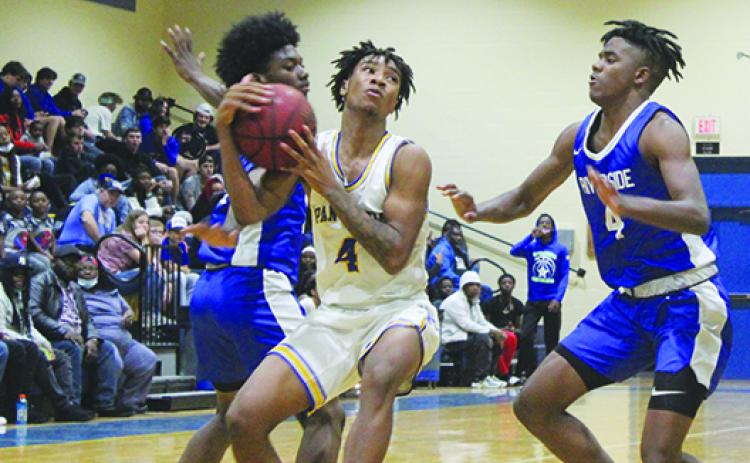 Palatka’s Chavaris Dumas (middle) was a member of last year’s All-County boys basketball team as the point guard for Interlachen High. (MARK BLUMENTHAL / Palatka Daily News)