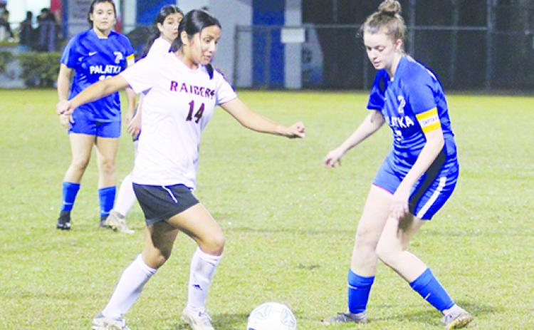 Crescent City’s Miriam Ocampo (left) and Palatka’s Mattie Smith vie for a loose ball during the Dec. 15 game at Bennett-Cooper Field at Veterans Memorial Stadium. Both are on the All-County team. (MARK BLUMENTHAL / Palatka Daily News)